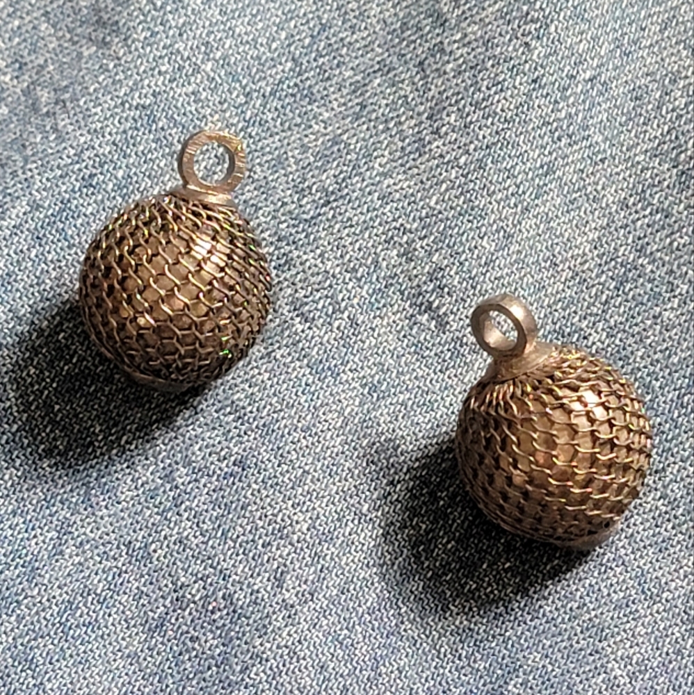 Pair of silver mesh buttons. Excellent condition. 1 inch round.